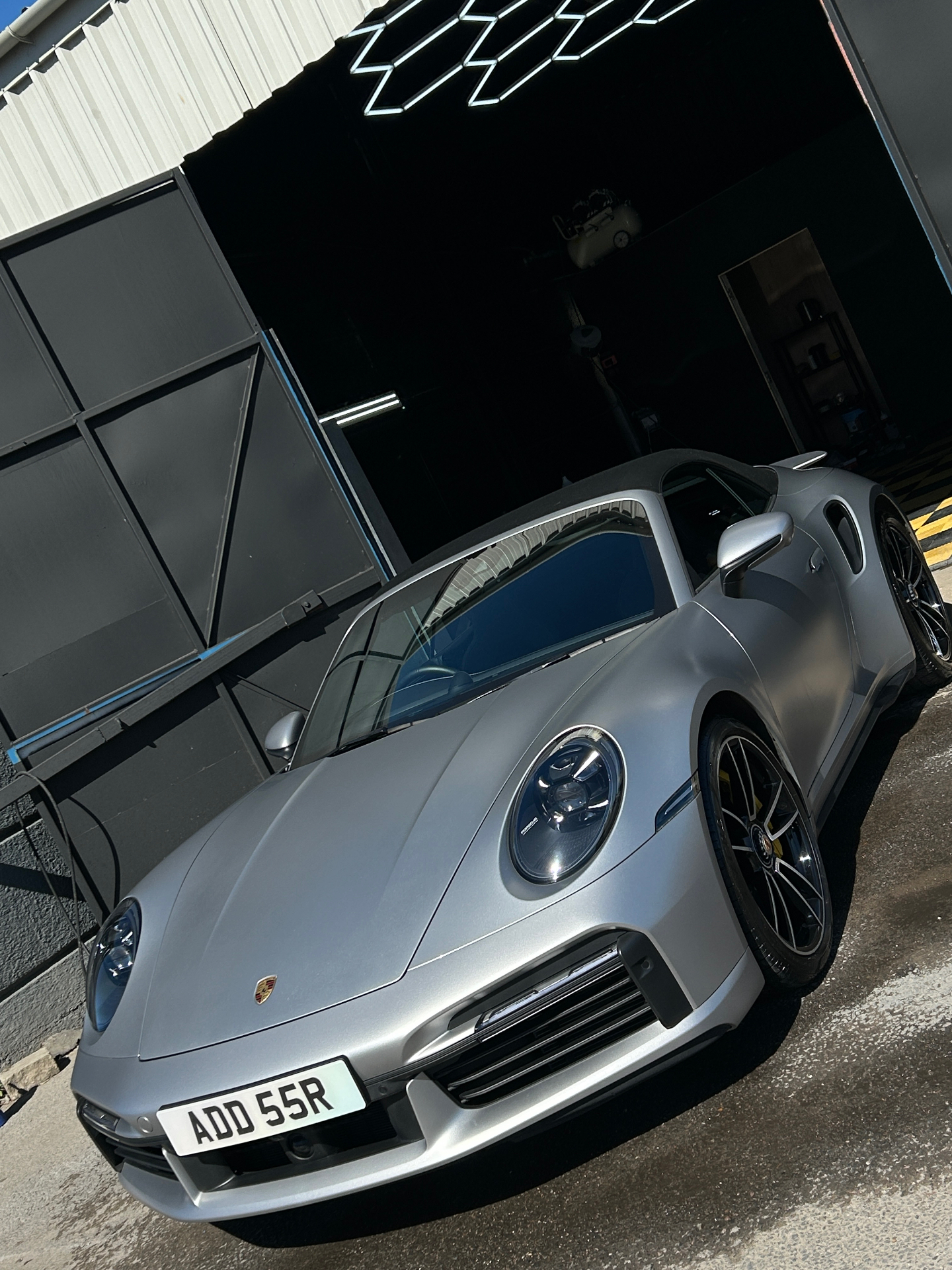 Glossy black sports car detailed to a mirror finish